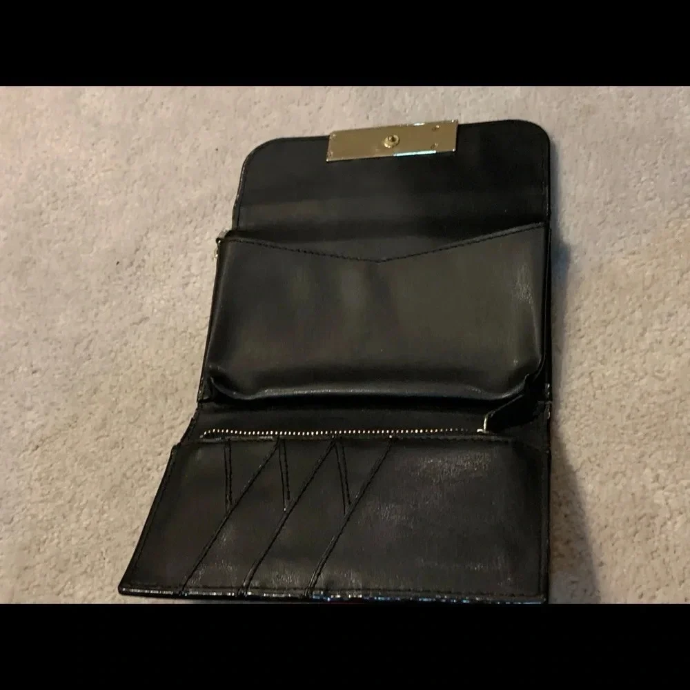 VICTORIA’S Secret shimmer phone wallet, golden